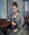 Madame Cezanne apoyada en una mesa Paul Cezanne